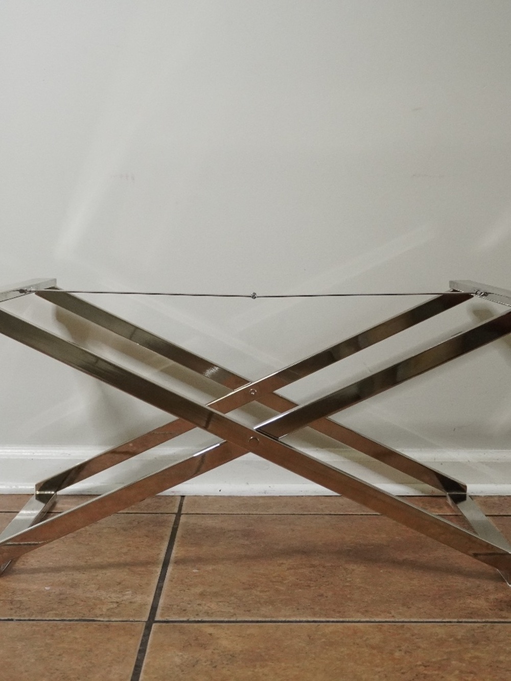 West Elm chrome tray table stand features a polished metal finish